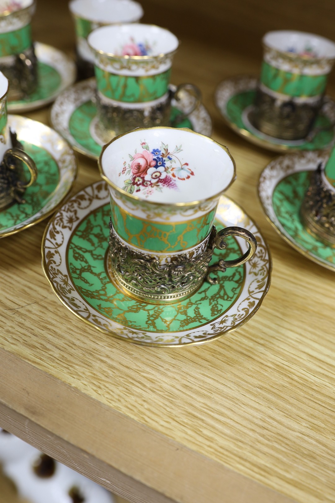 A Hammersley & Co porcelain coffee set with associated silver gilt cup holders